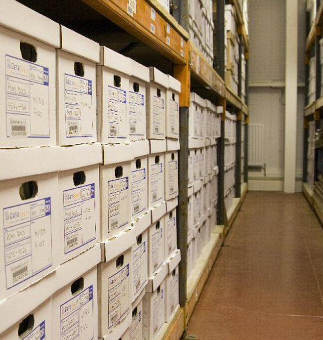 Rows of archival storage boxes in local storage facility