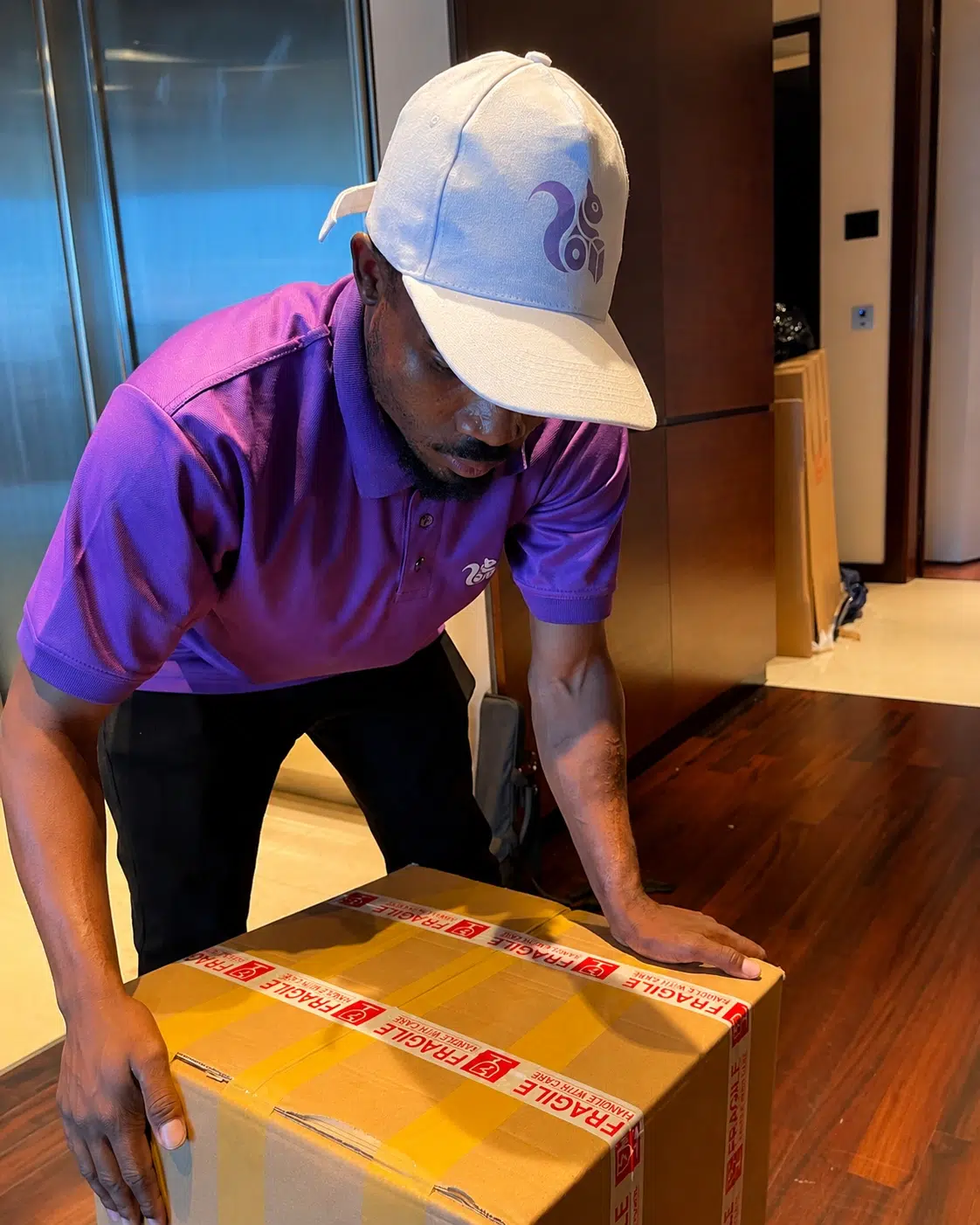 PurpleBox team packing household items in Dubai